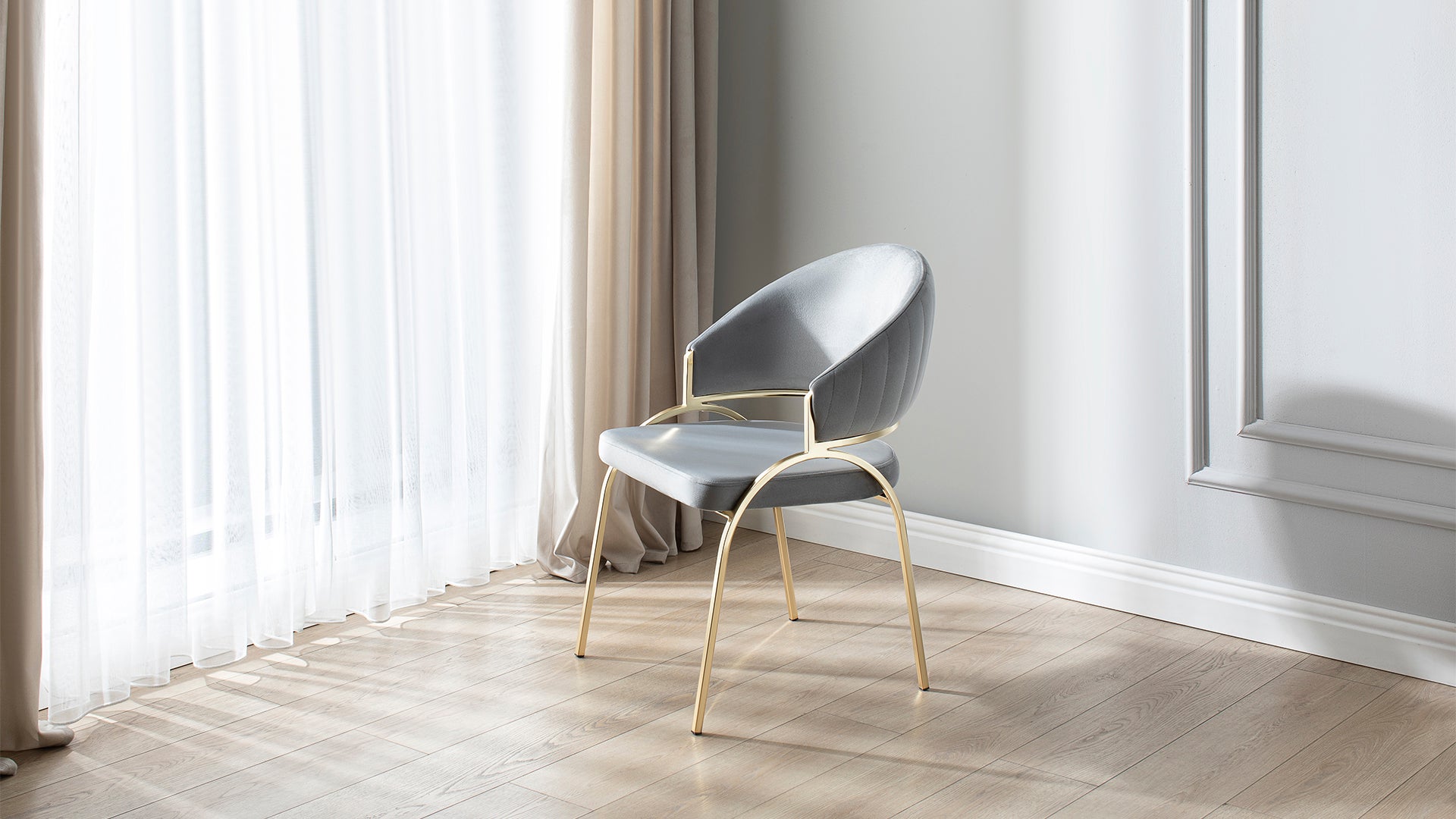 Grey velvet dining chair with gold legs and quilted backrest modern design