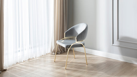 Grey velvet dining chair with gold legs and quilted backrest modern design