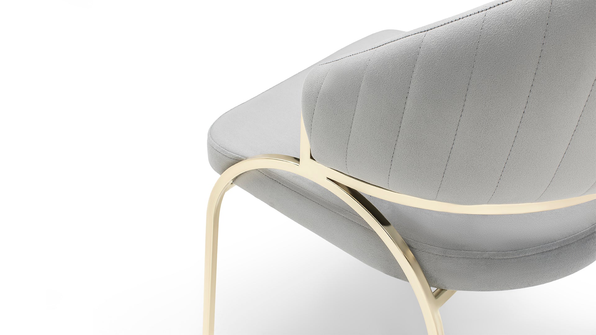 Grey upholstered accent chair with plush diamond stitching and a polished gold metal frame
