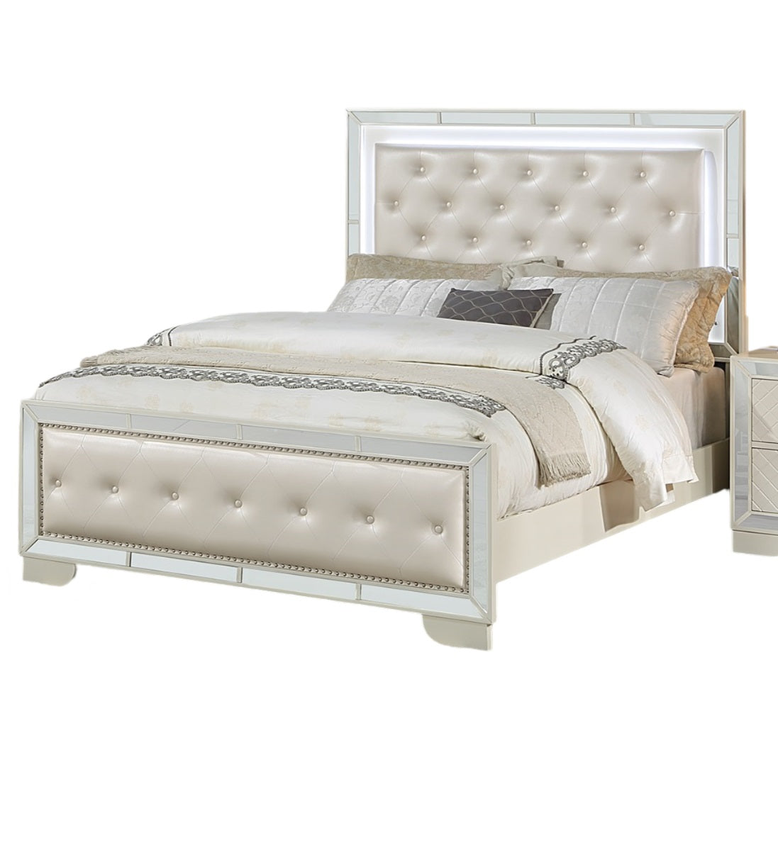 Tufted cream leather upholstered bed frame with mirrored accents and LED headboard lighting for a glamorous bedroom