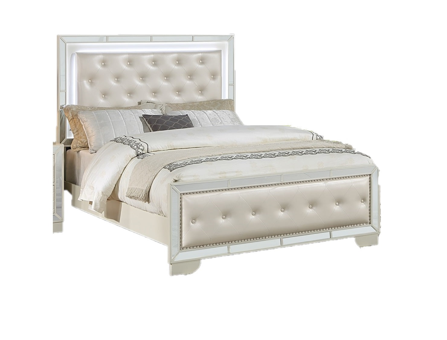 Cream upholstered tufted bed with mirrored accents and LED headboard lights a luxurious bedroom centerpeice