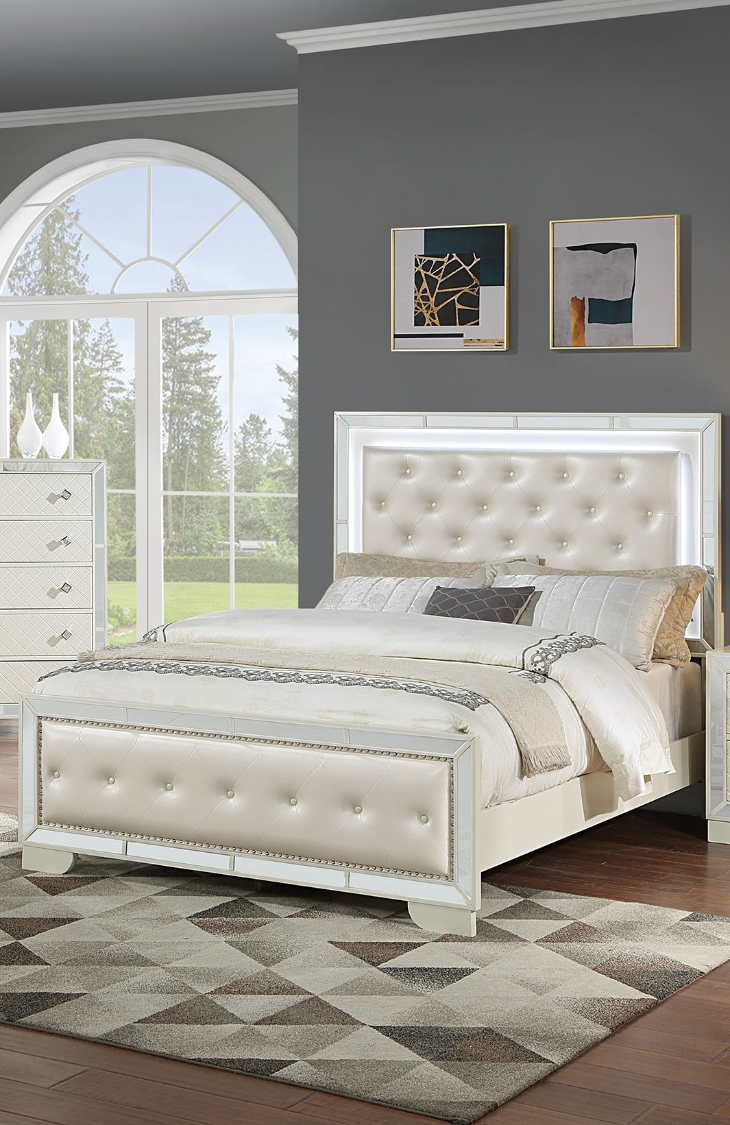 Tufted cream leather bed with mirrored frame and LED headboard light