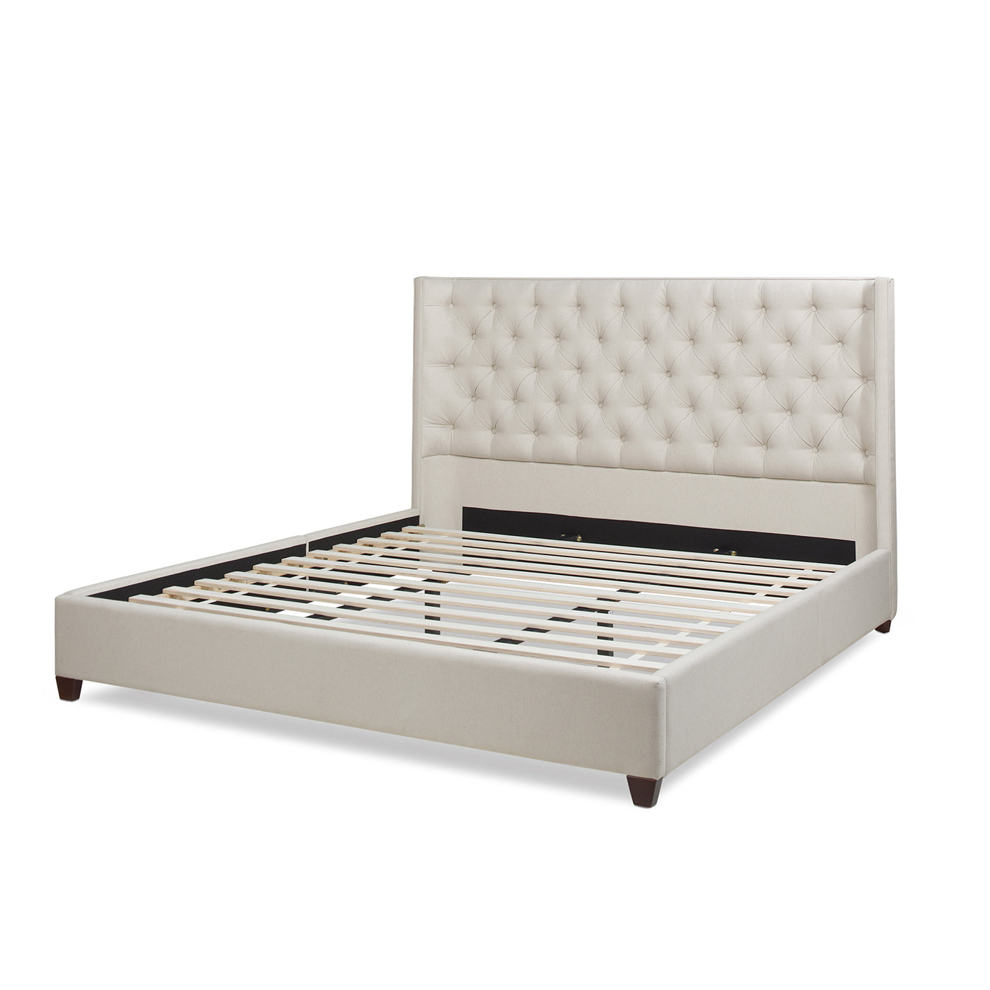 Upholstered beige bed frame with tufted headboard and wooden slats