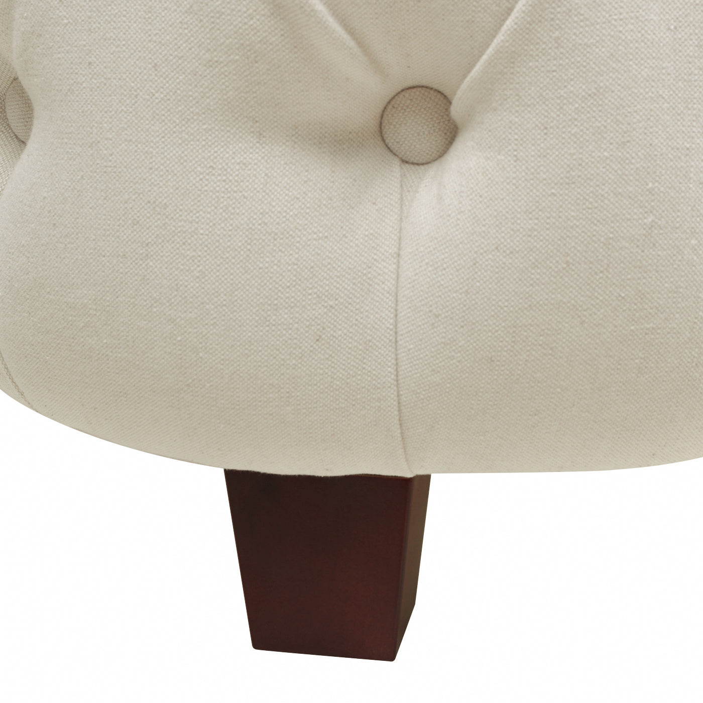 Tufted cream fabric ottoman with dark wood legs