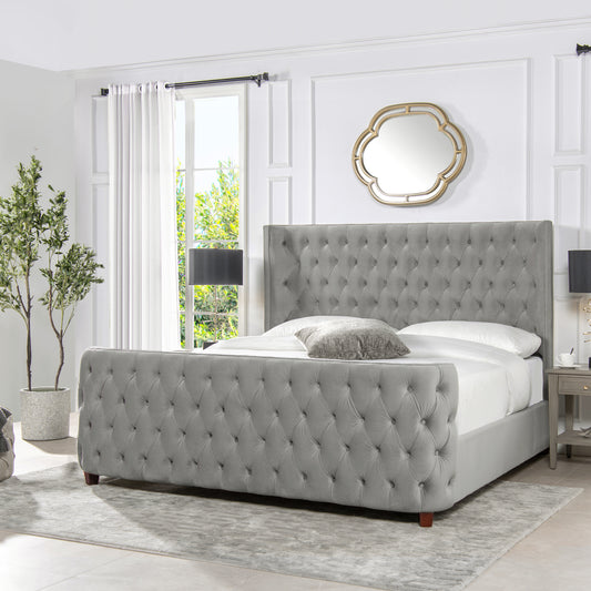 Elegant grey velvet tufted bed with a high headboard perfect for master bedrooms