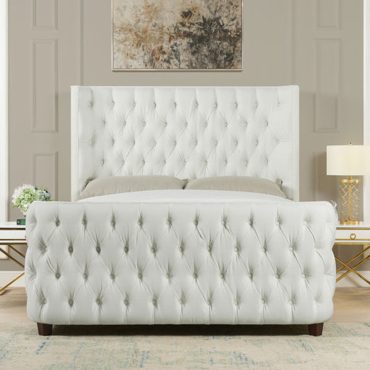 Luxurious white tufted bed frame with diamond button detailing and dark wood legs