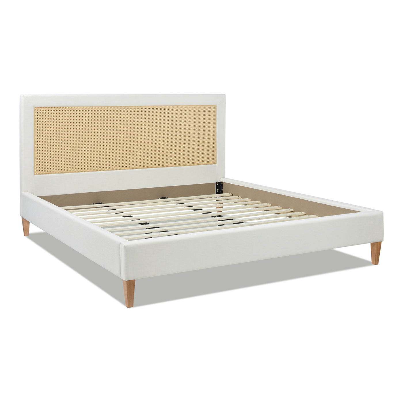 White upholstered bed frame with cane headboard modern design