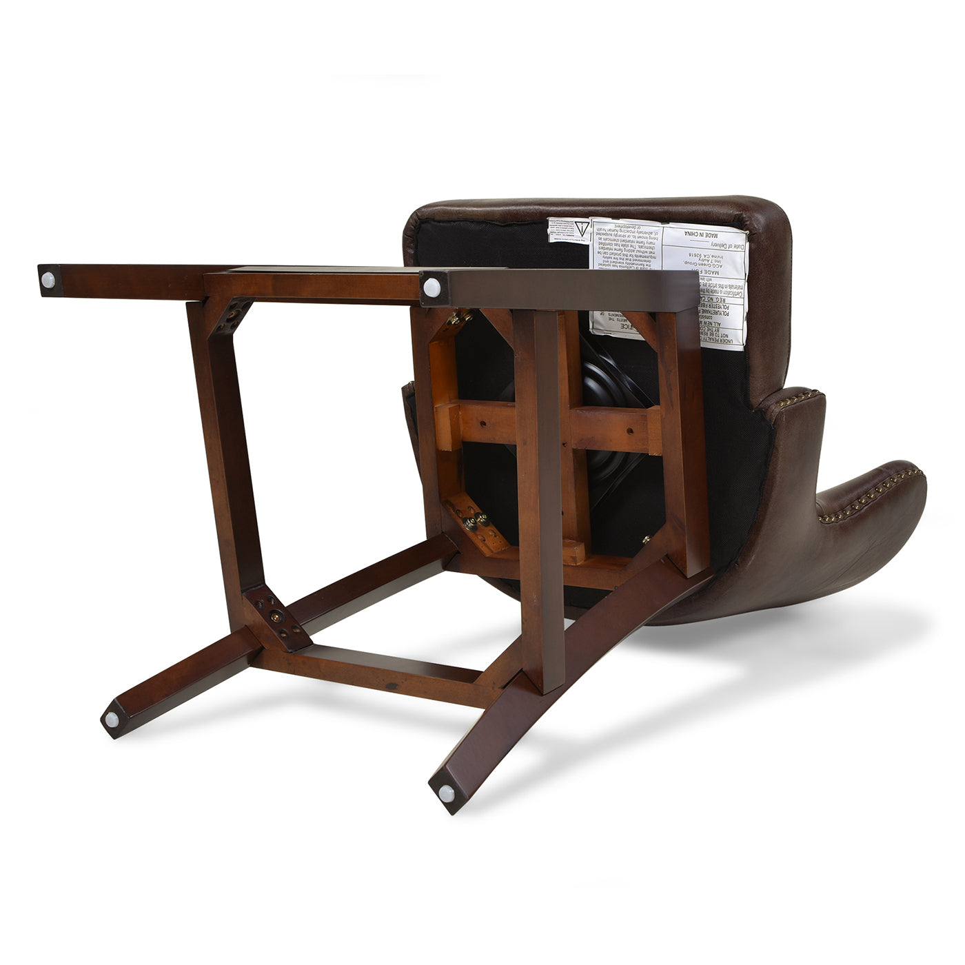 Upside down view of a brown leather accent chair with visible wooden base and upholstered seat