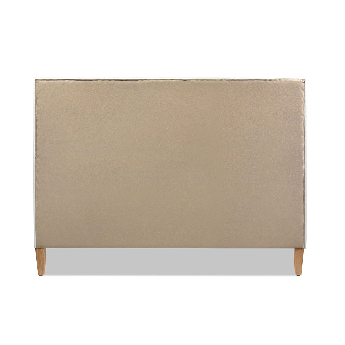 Upholstered tan headboard with natural wood legs for a modern bedroom
