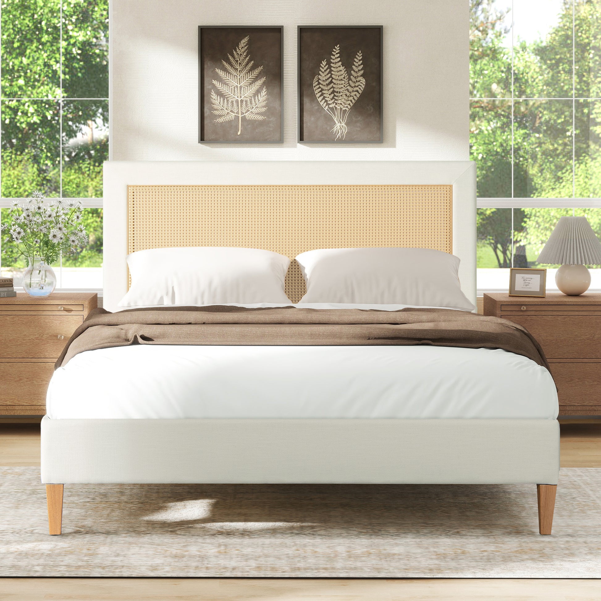White upholstered bed with woven cane headboard and wooden legs