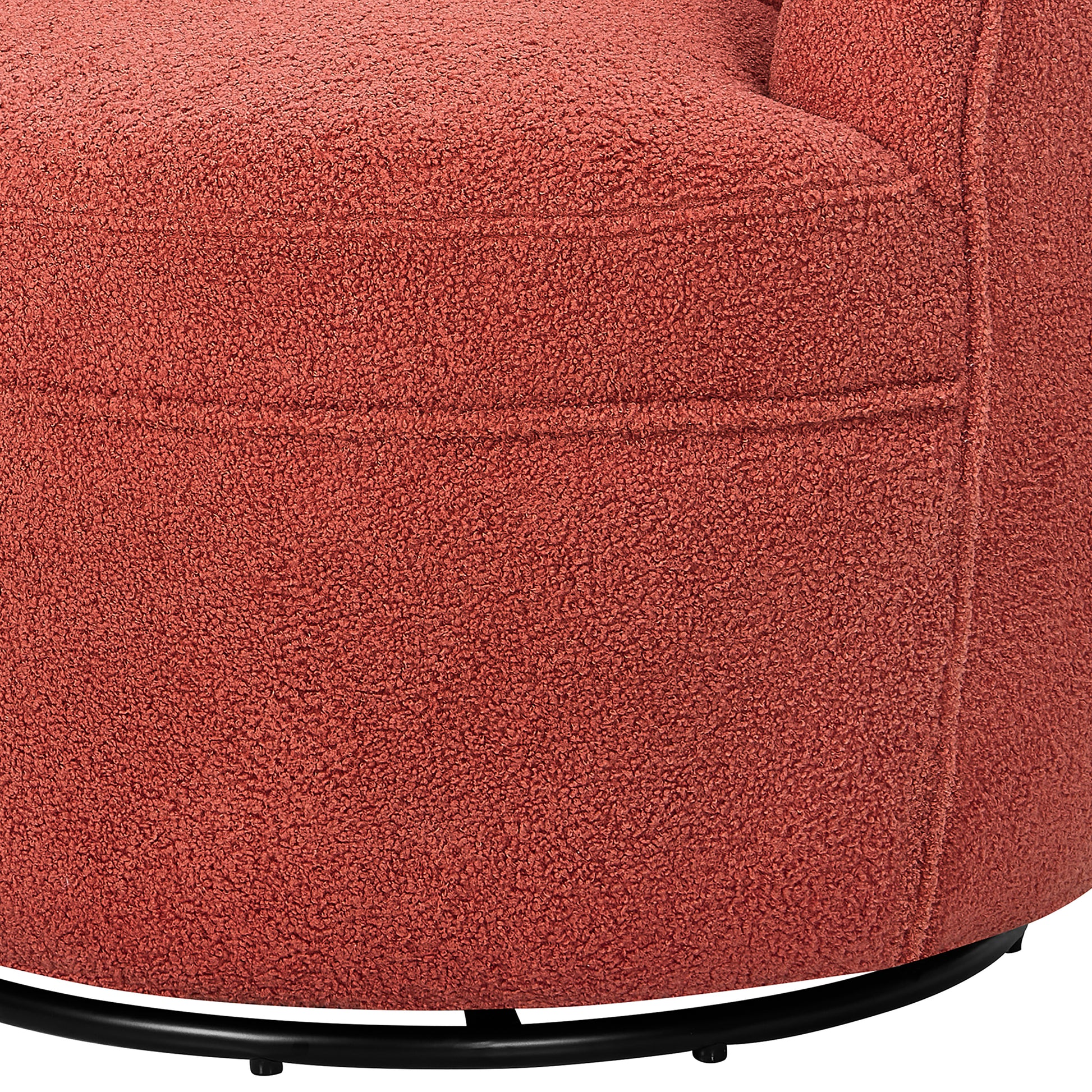 Closeup of a rustcolored boucle armchair base with a black metal ring stand