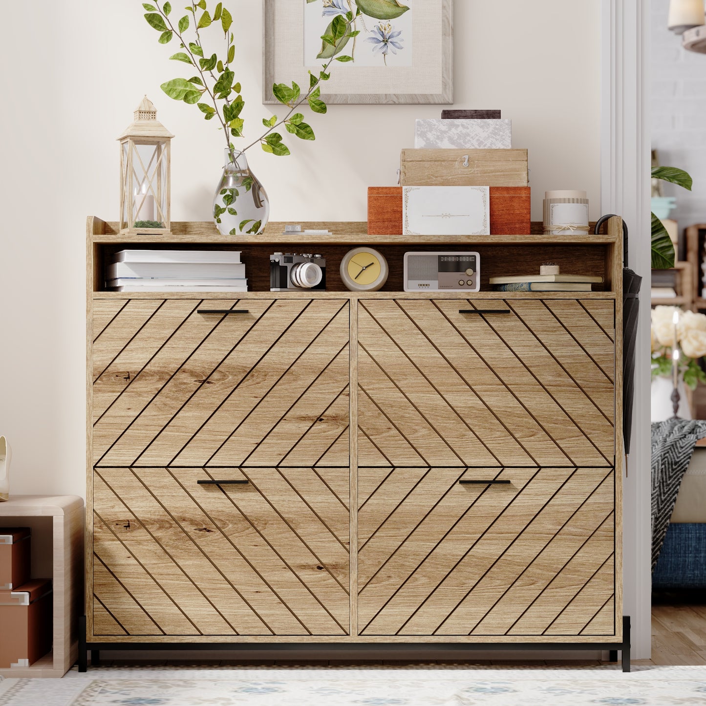 Wooden shoe cabinet with angled front panels and black handles
