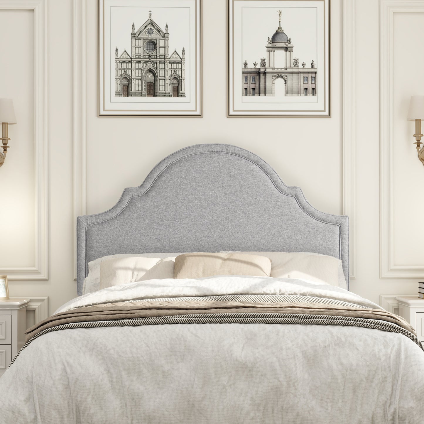 Grey upholstered headboard with scalloped top for a classic bedroom style