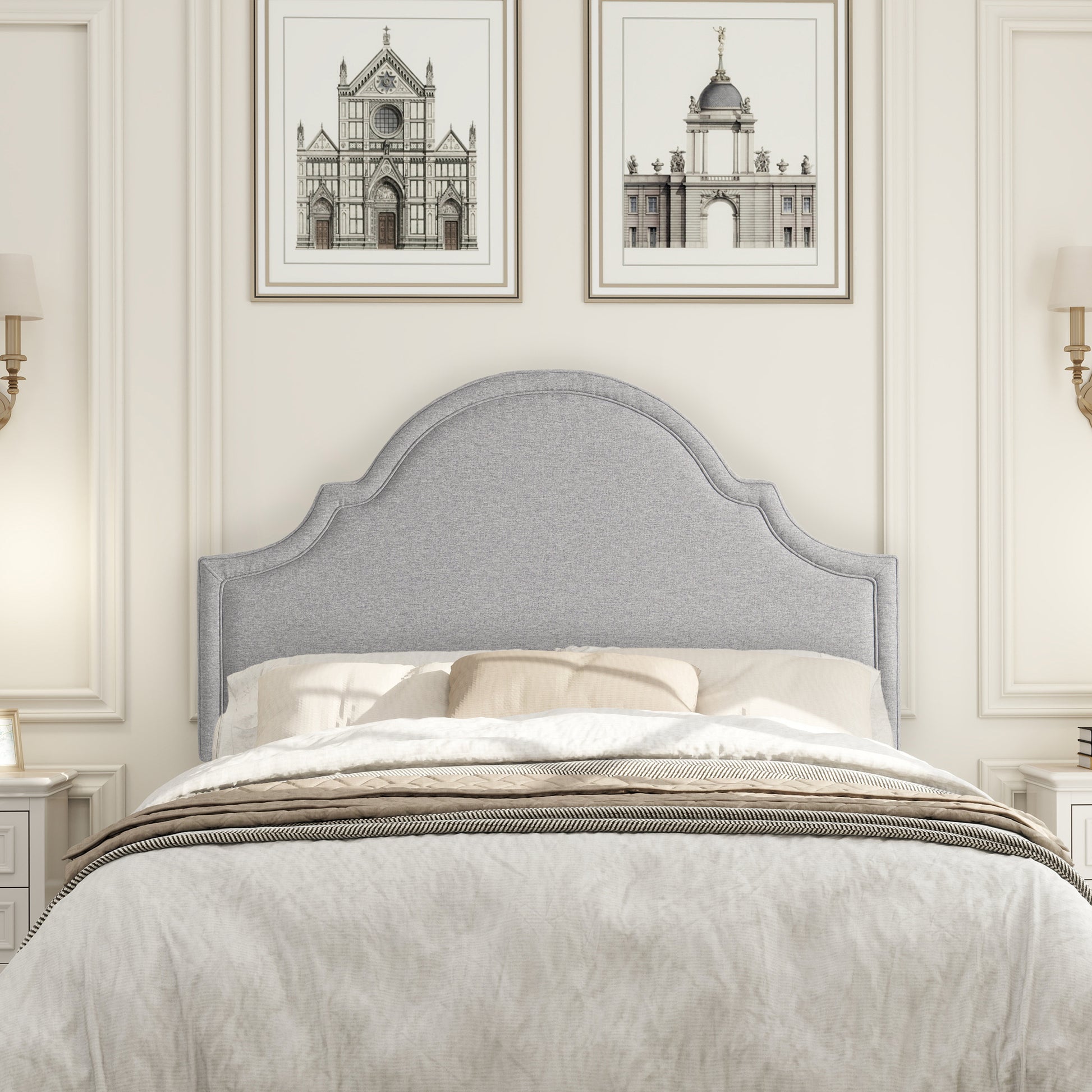 Grey upholstered headboard with scalloped top for a classic bedroom style