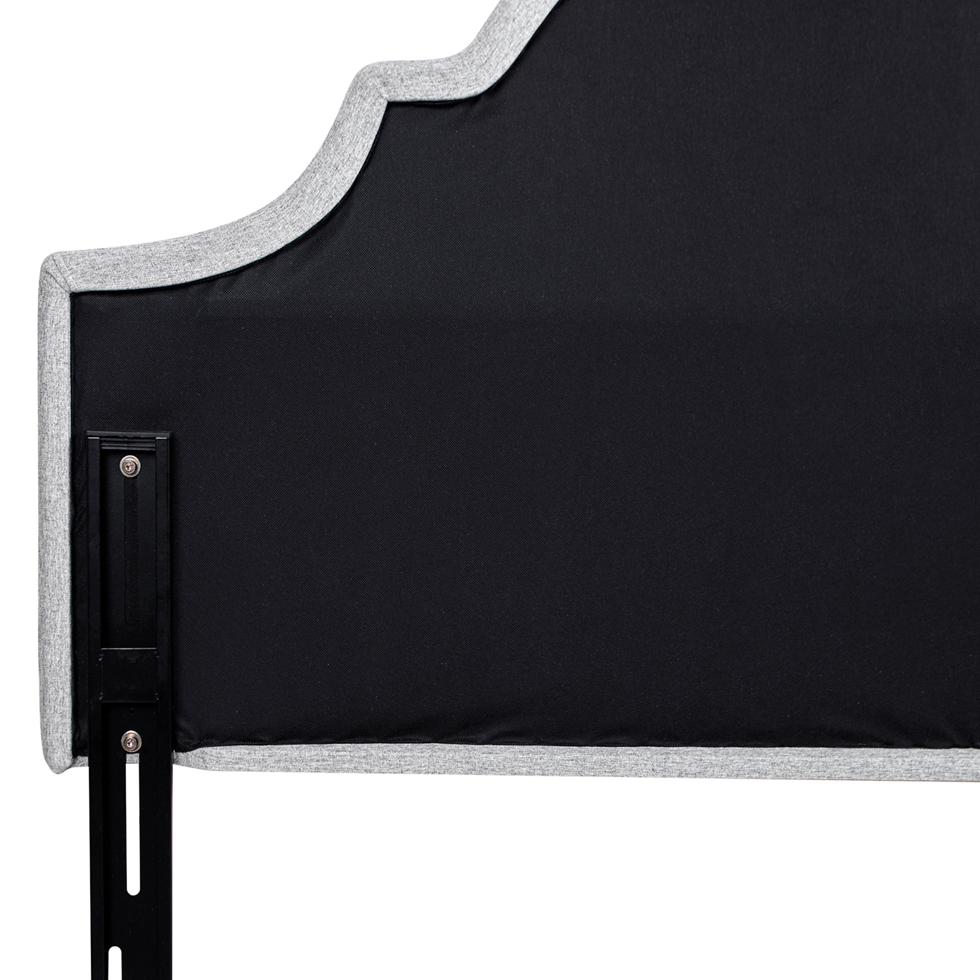 Grey upholstered headboard with black metal bed frame attachment
