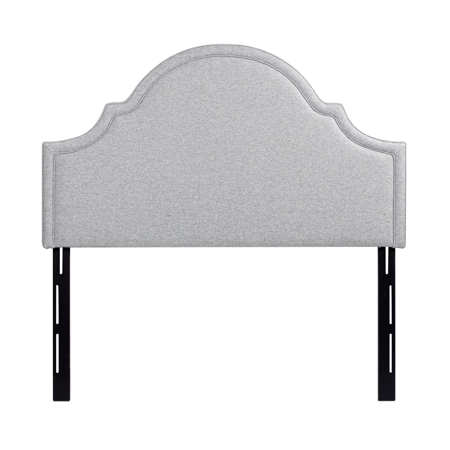 Light grey fabric headboard with a scalloped top and upholstered frame for a queen bed