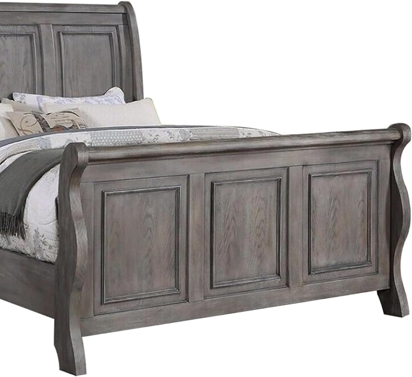 Gray wooden sleigh bed with paneled headboard and footboard