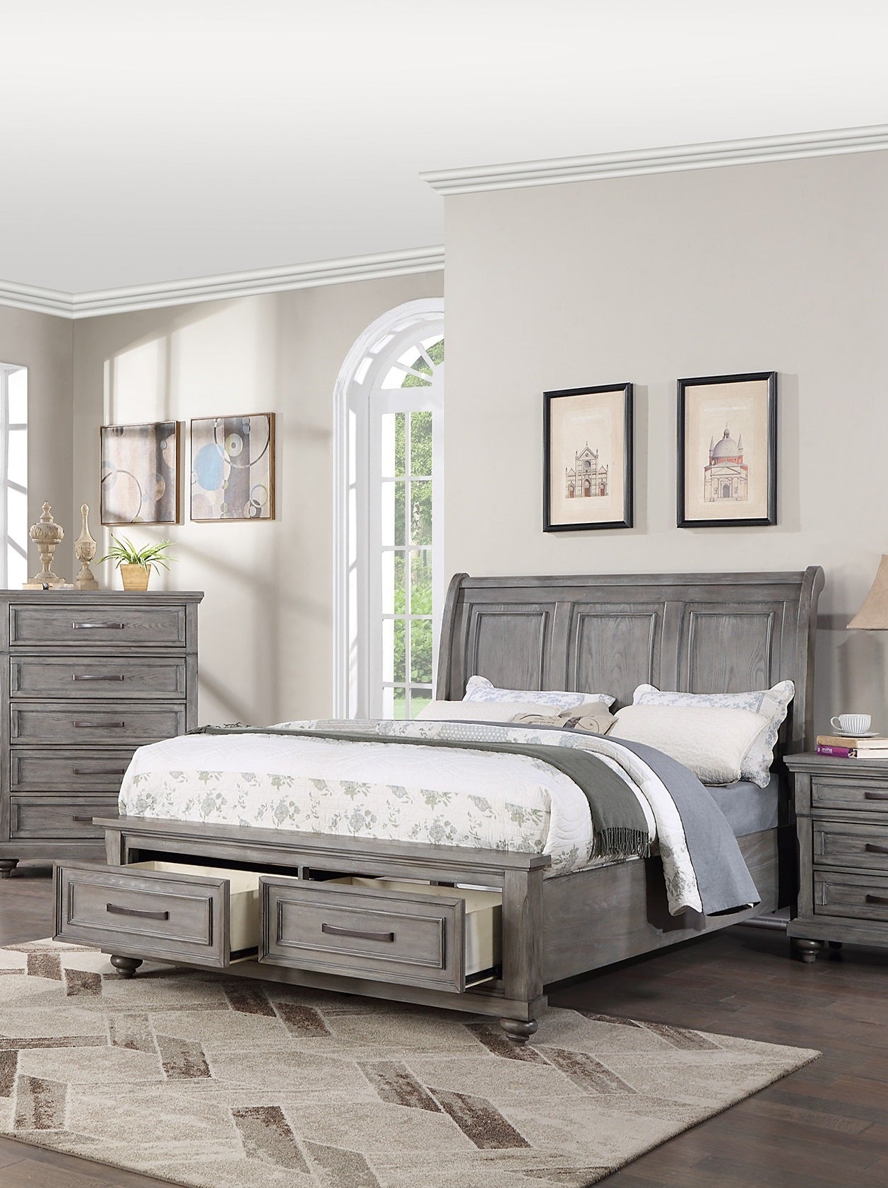 Grey wooden sleigh bed with storage drawers and a plush quilted comforter