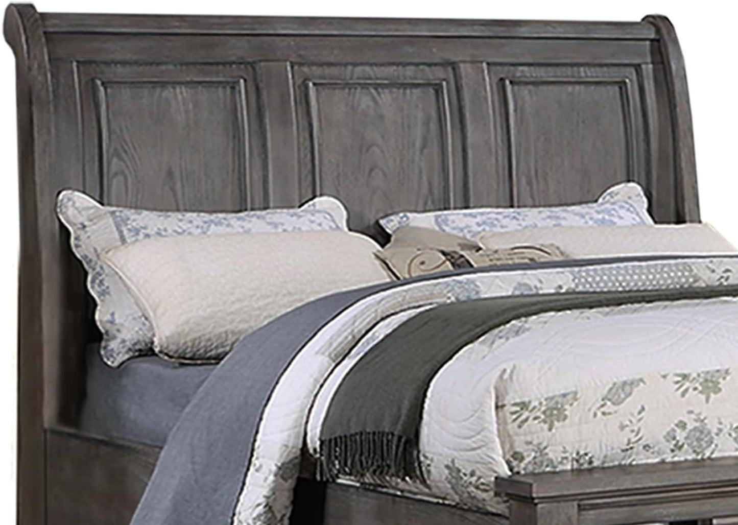 Gray wood sleigh headboard with paneled design and decorative pillows