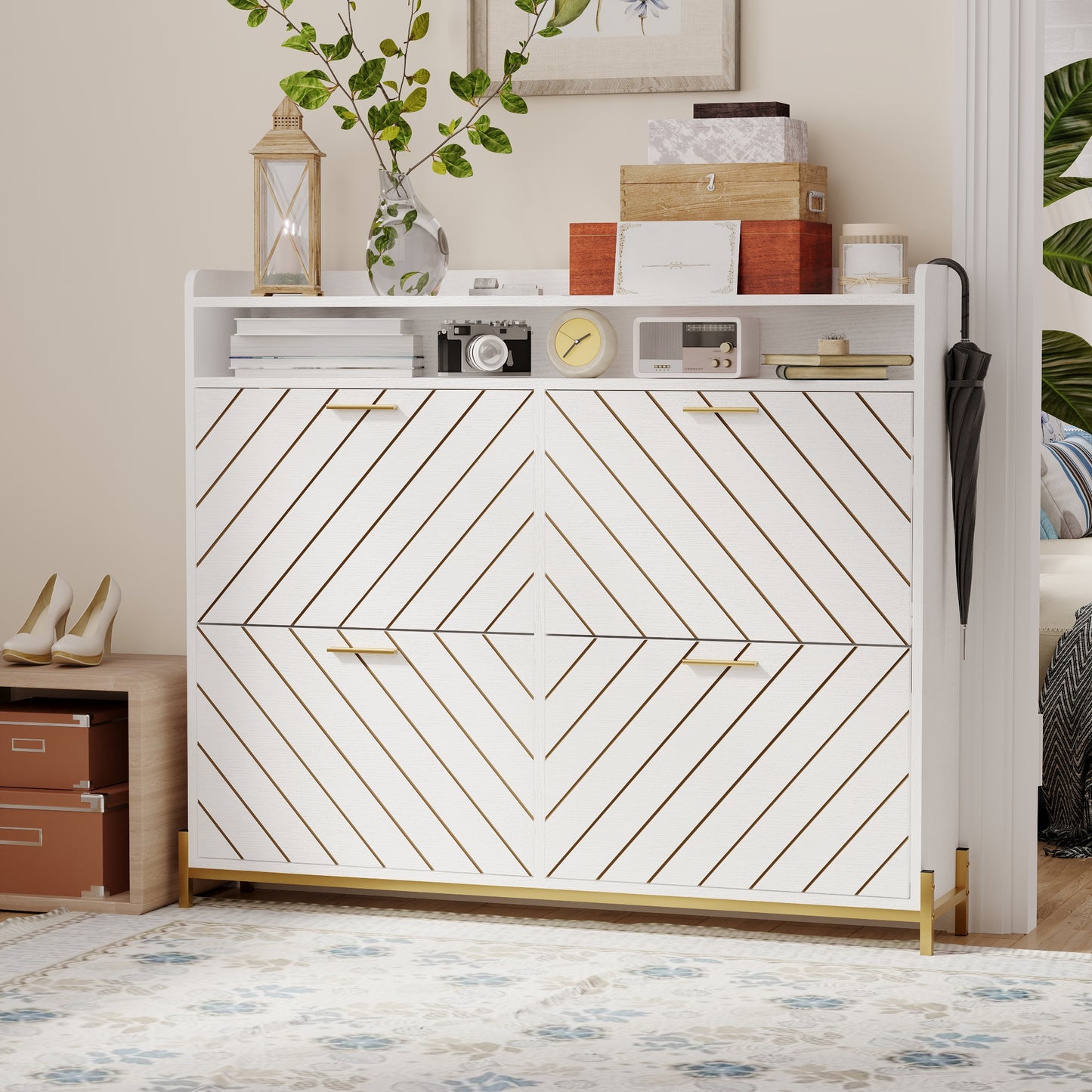 White shoe cabinet with gold accents and diagonal grooved doors