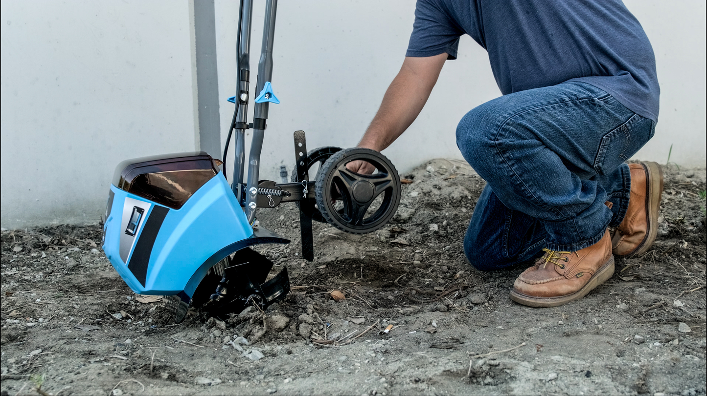 Blue and silver electric tiller with black tines ready for garden use