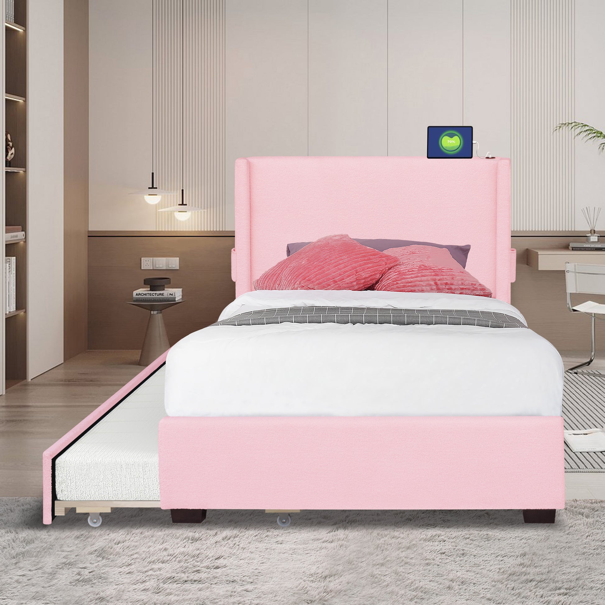Pink velvet twin bed with pullout trundle featuring a wingback headboard