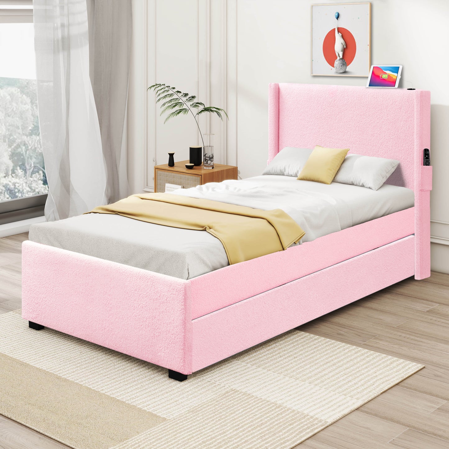 Plush pink twin bed frame with upholstered headboard and storage