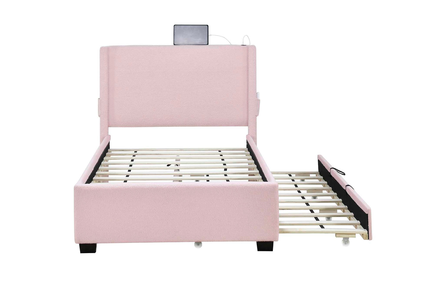 Pink upholstered bed frame with pullout trundle and integrated charging station