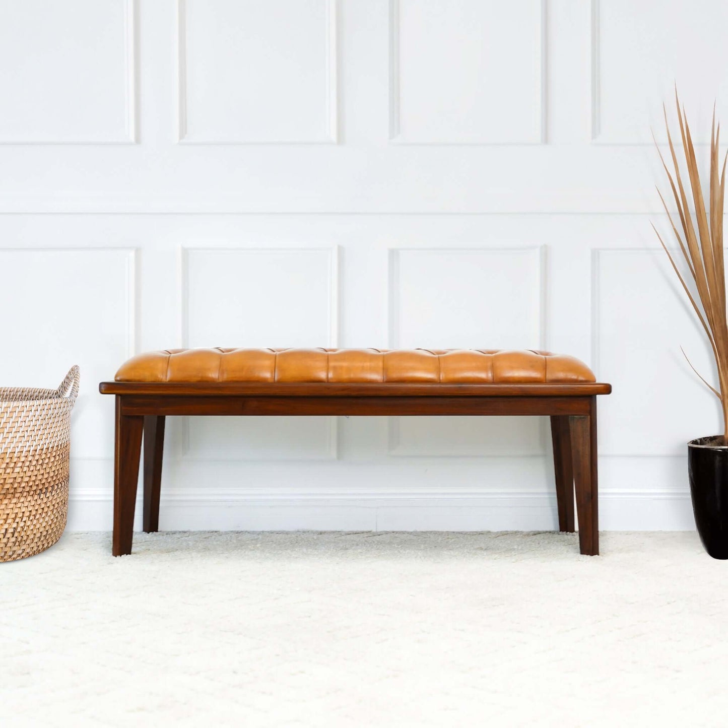 Tufted caramel leather bench with dark wood frame and legs perfect for entryways