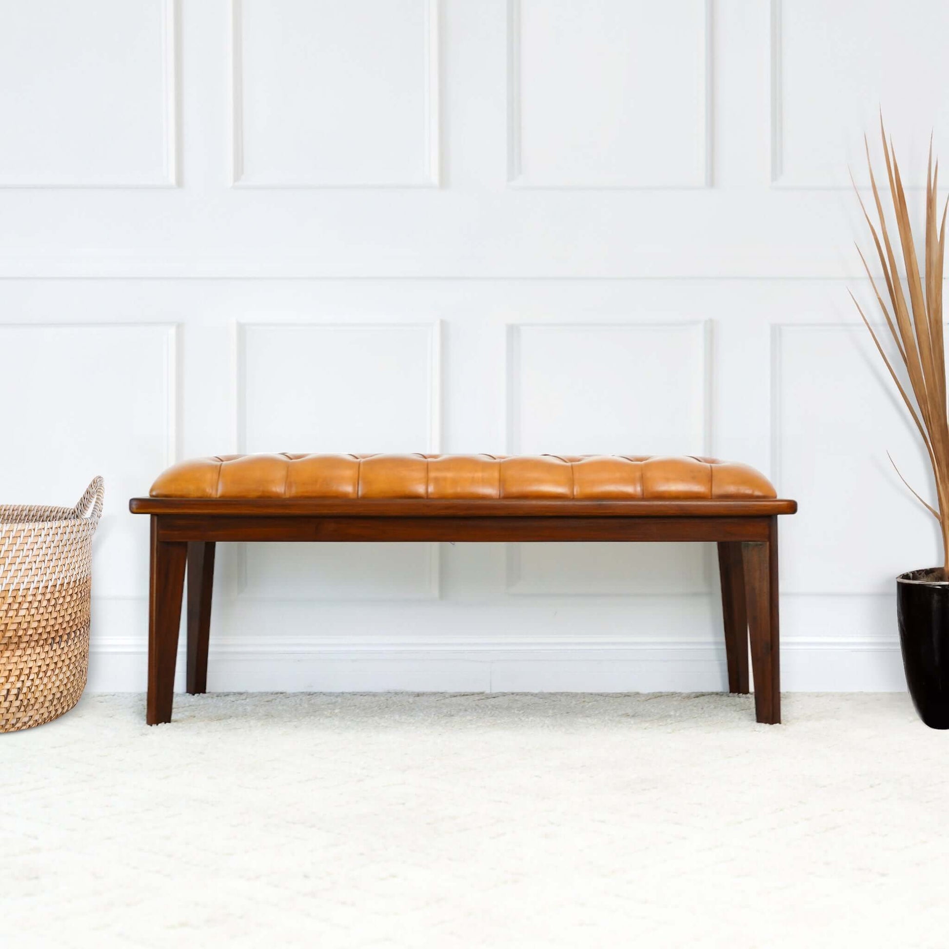 Tufted caramel leather bench with dark wood frame and legs perfect for entryways
