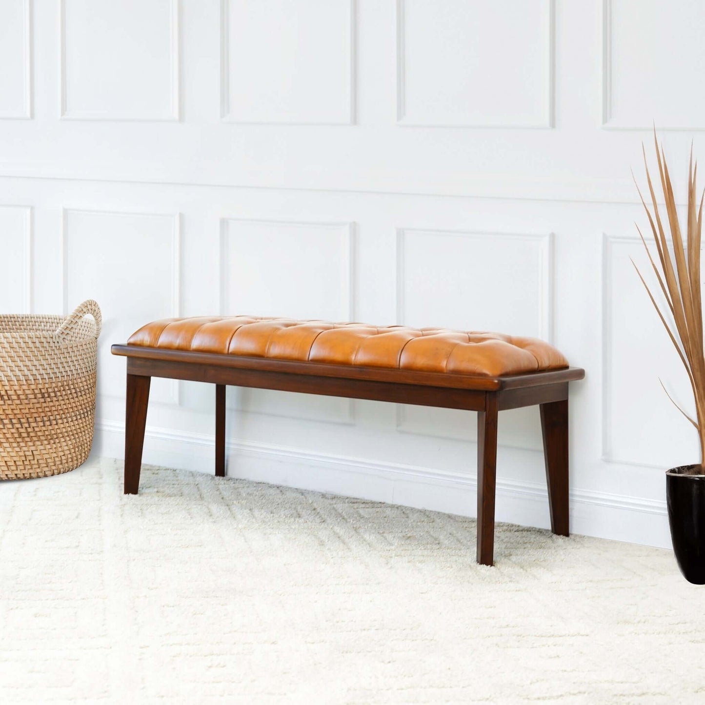 Tufted brown leather bench with dark wood frame ideal for entryway seating