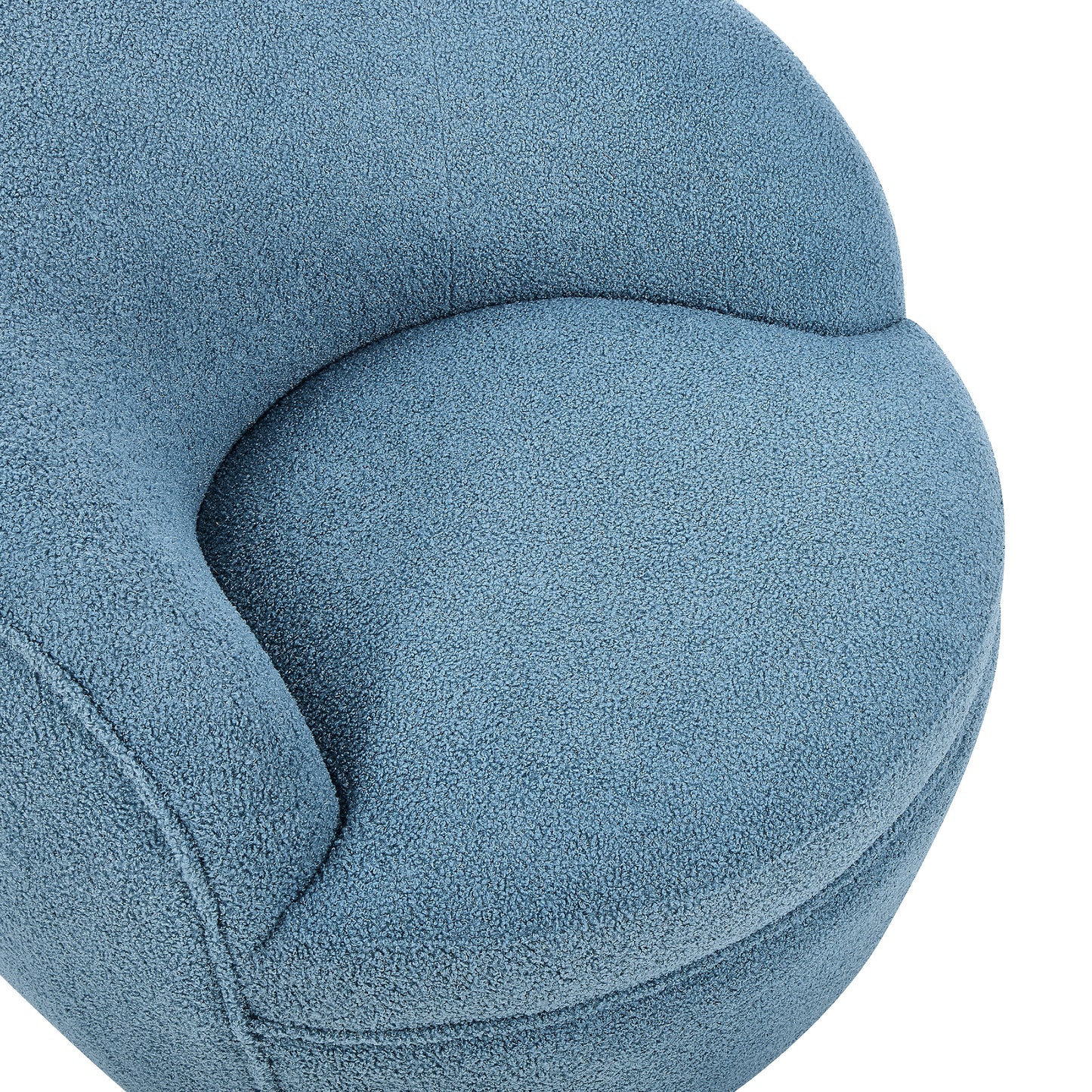 Closeup of a plush blue boucle armchair with soft curves and textured fabric