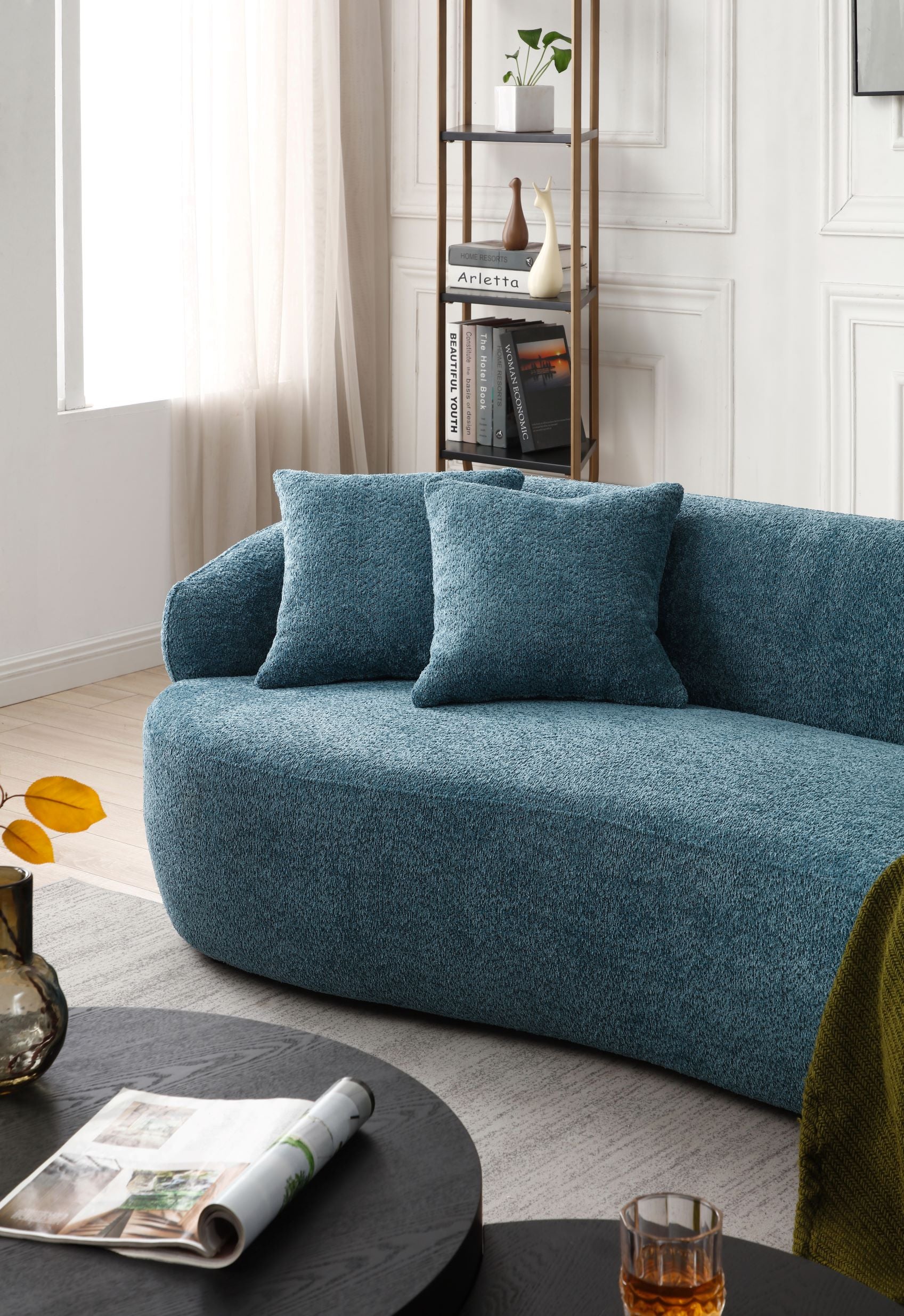 Textured blue boucle fabric sofa with plush throw pillows for living room comfort