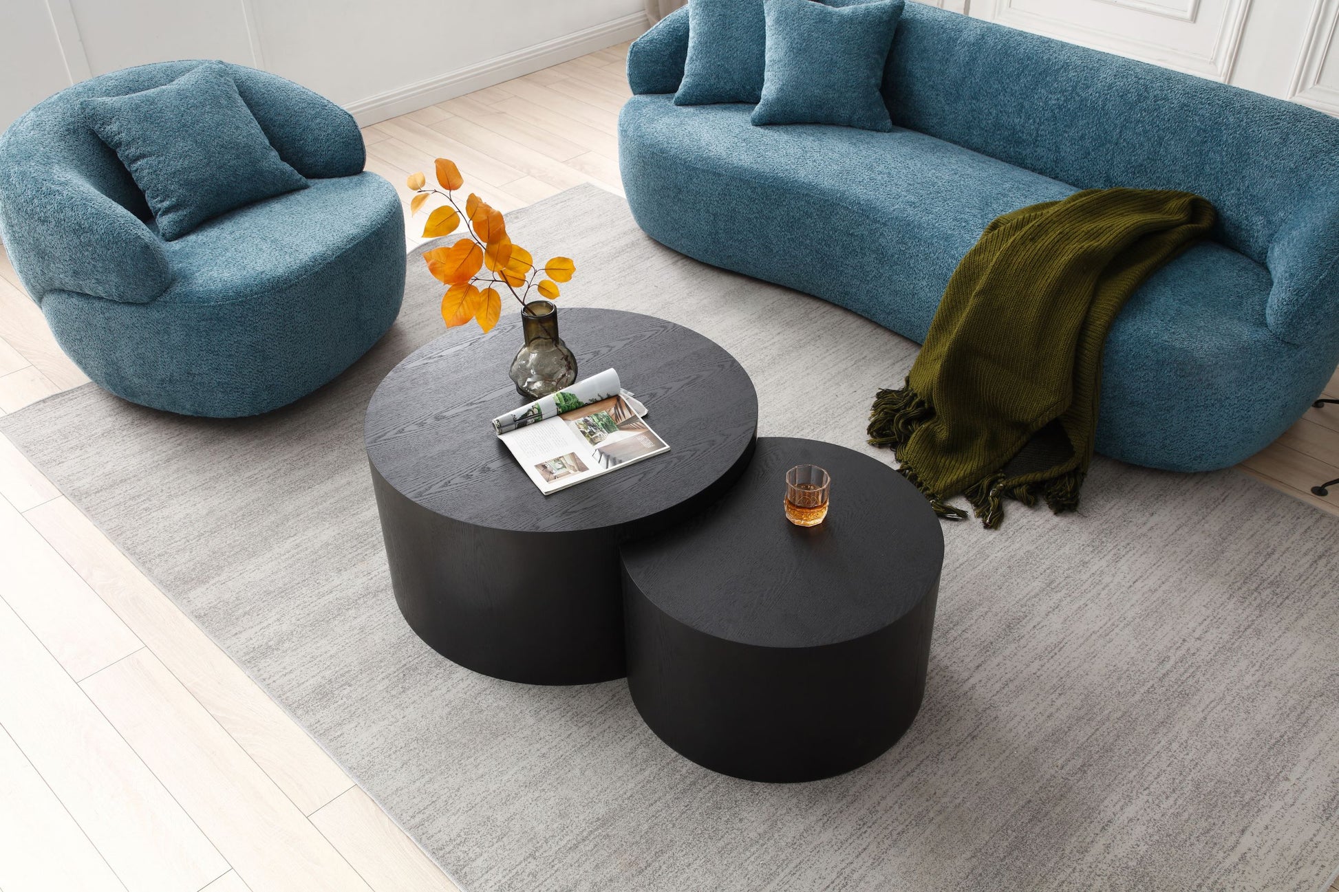 Round nesting coffee tables in black oak wood finish add modern style to living spaces