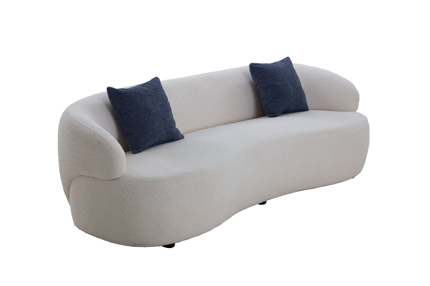 Curved boucle sofa in cream with two navy blue accent pillows modern living room furniture