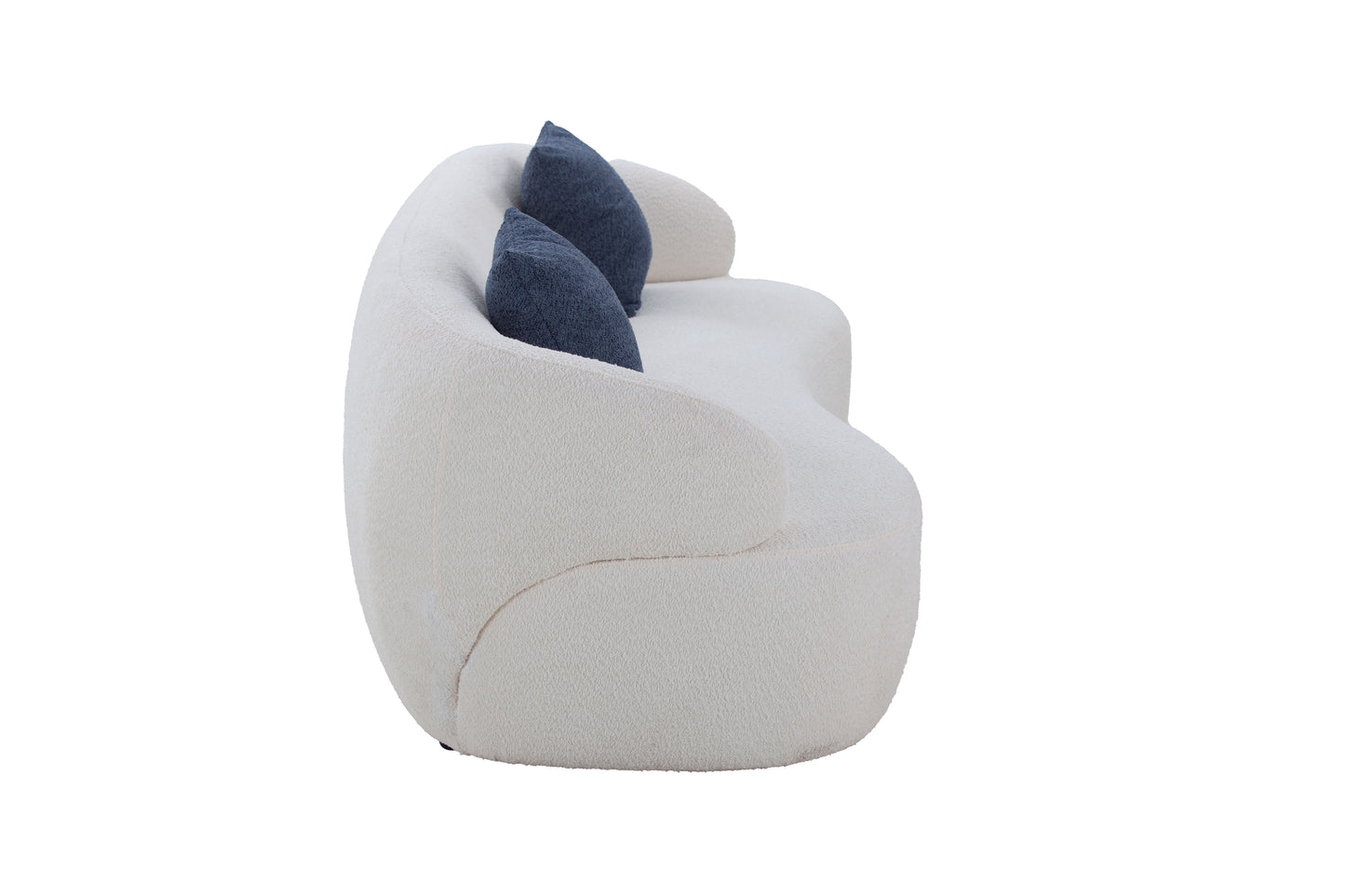 Cream boucl fabric curved sofa with two navy blue textured accent pillows