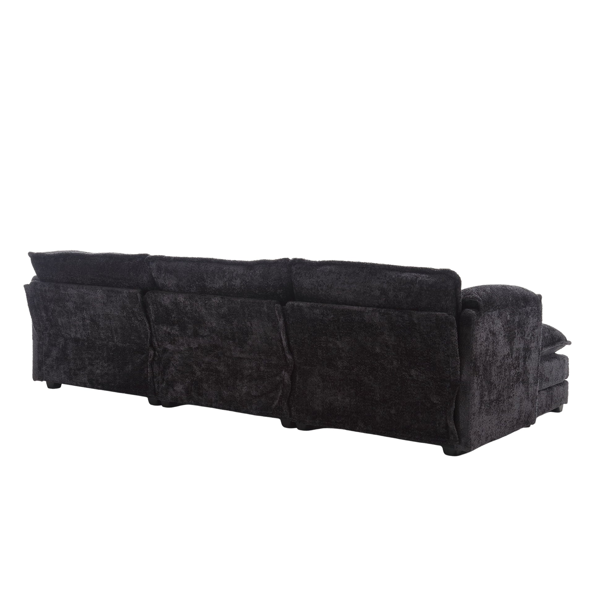 View of the back of a plush black fabric sectional sofa with adjustable headrests