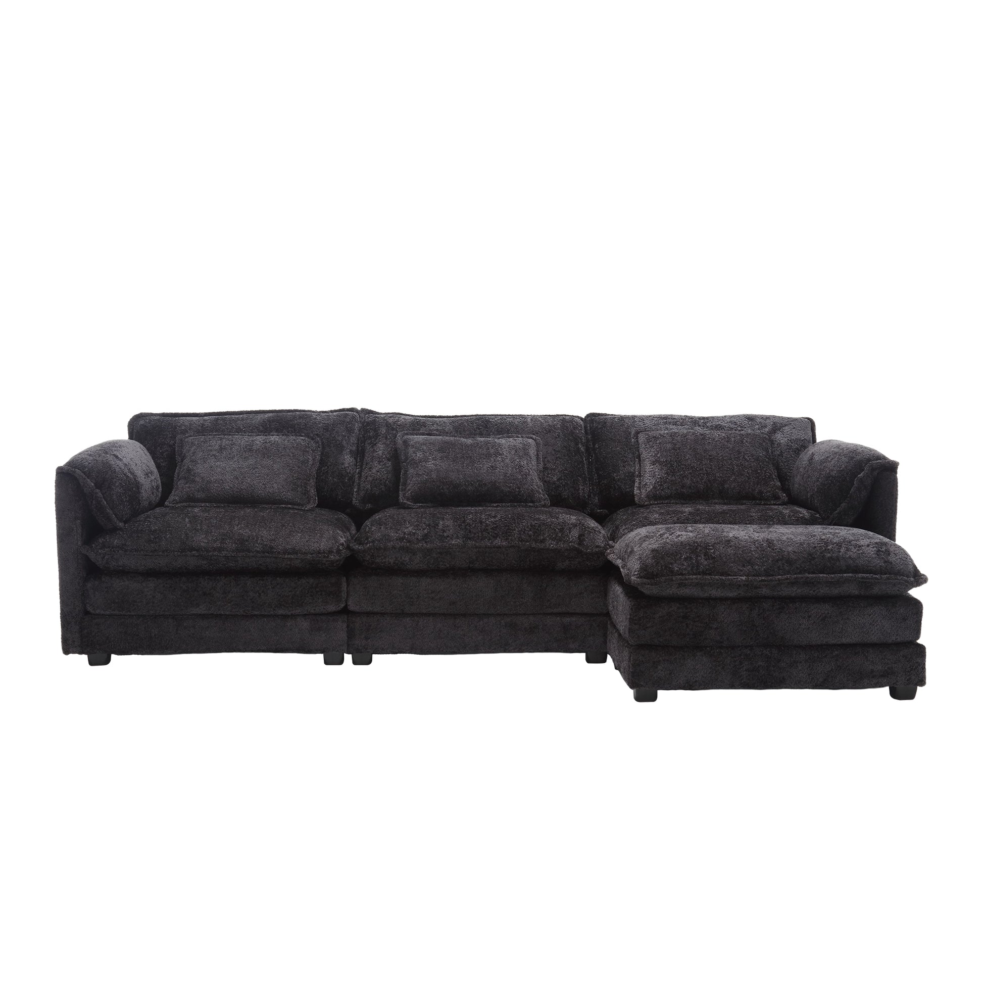 Dark charcoal sectional sofa with plush fabric and three accent pillows perfect for modern living rooms