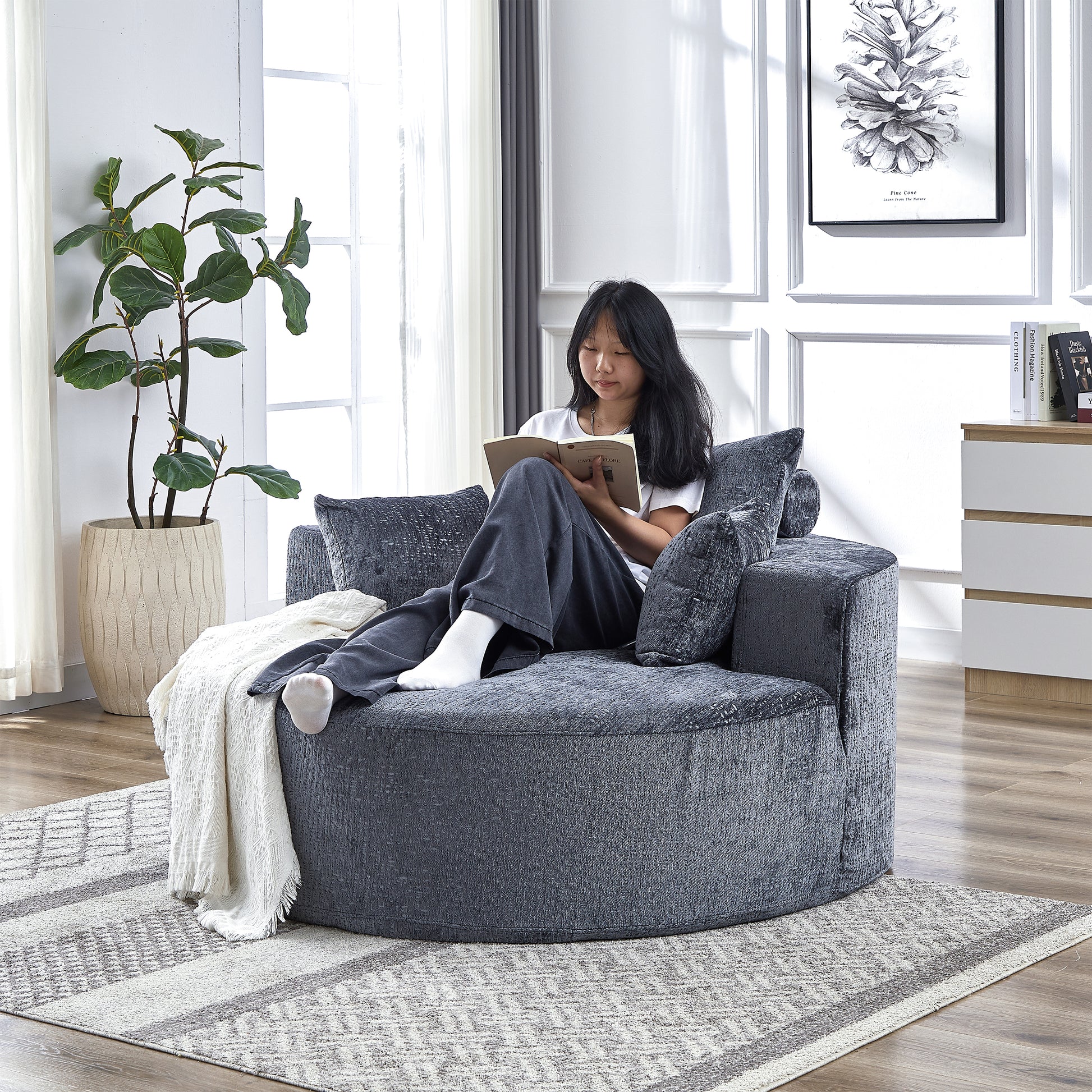 Plush dark grey swivel accent chair with textured fabric perfect for a cozy reading nook