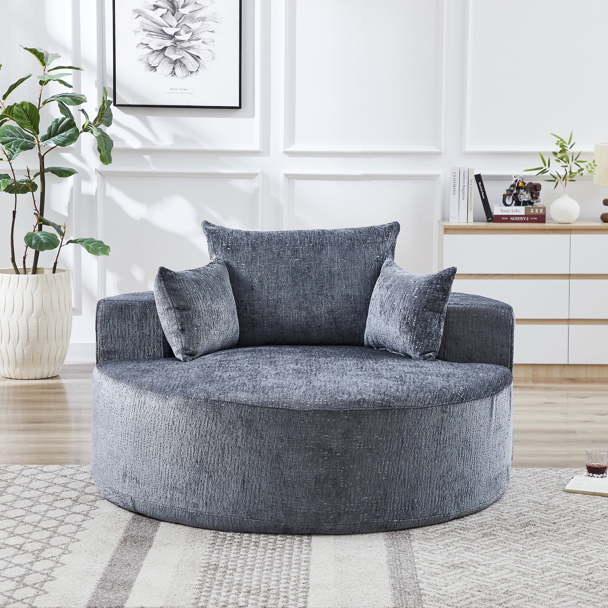 Plush gray swivel chair with textured fabric and accent pillows perfect for a cozy living room