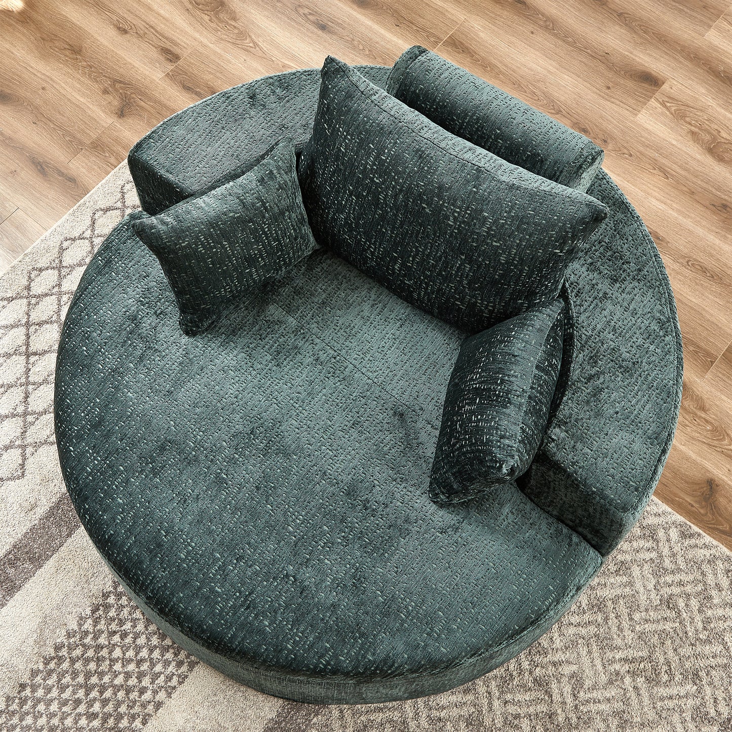 Plush teal velvet sectional sofa with textured fabric and scattered cushions