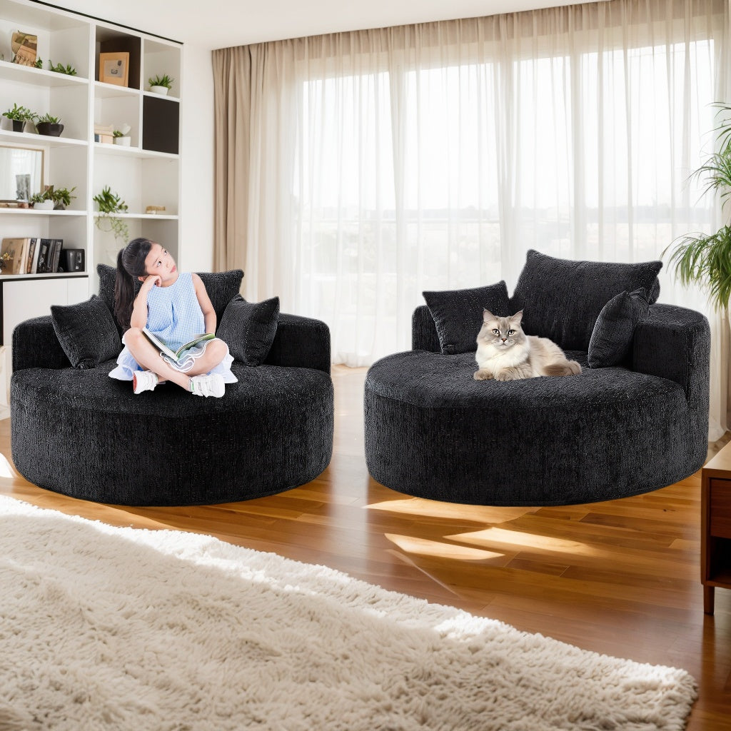 Plush black swivel armchair with a young girl reading a book perfect for cozy reading nooks
