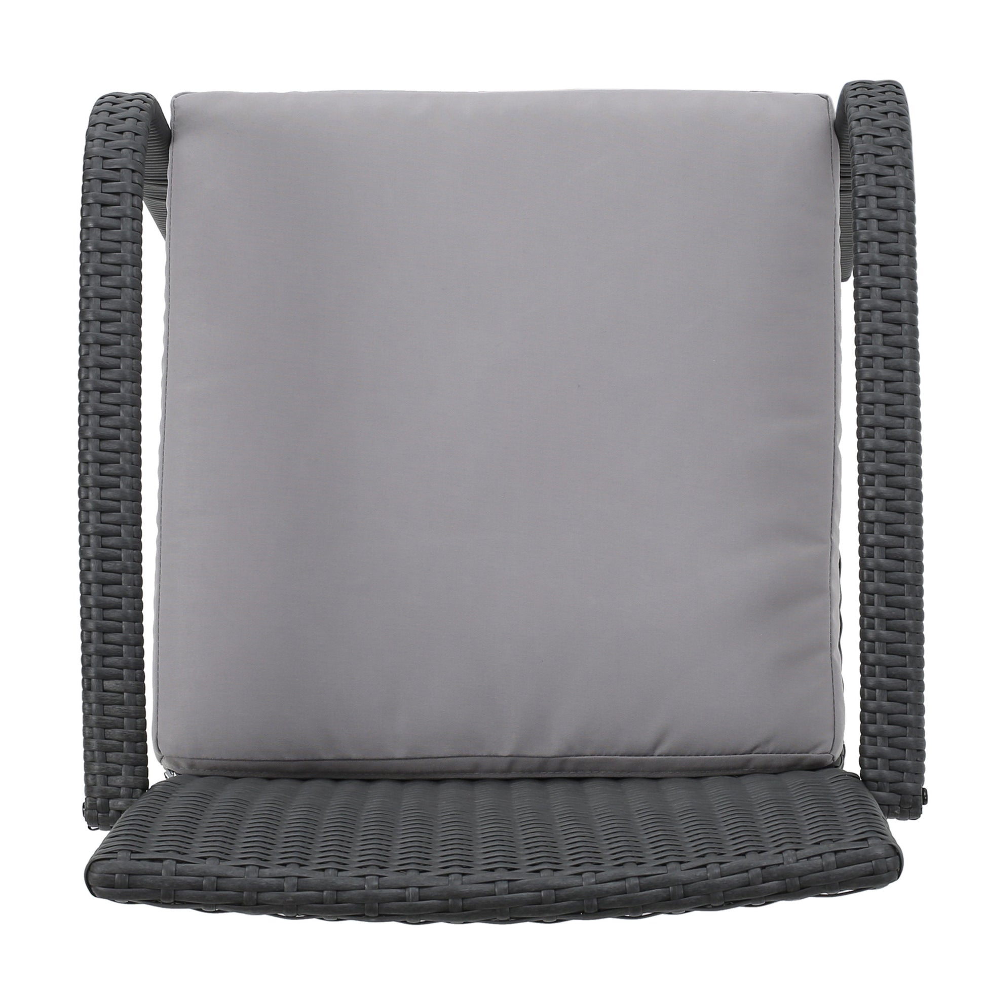 Gray wicker chair with plush seat cushion perfect for patio relaxation