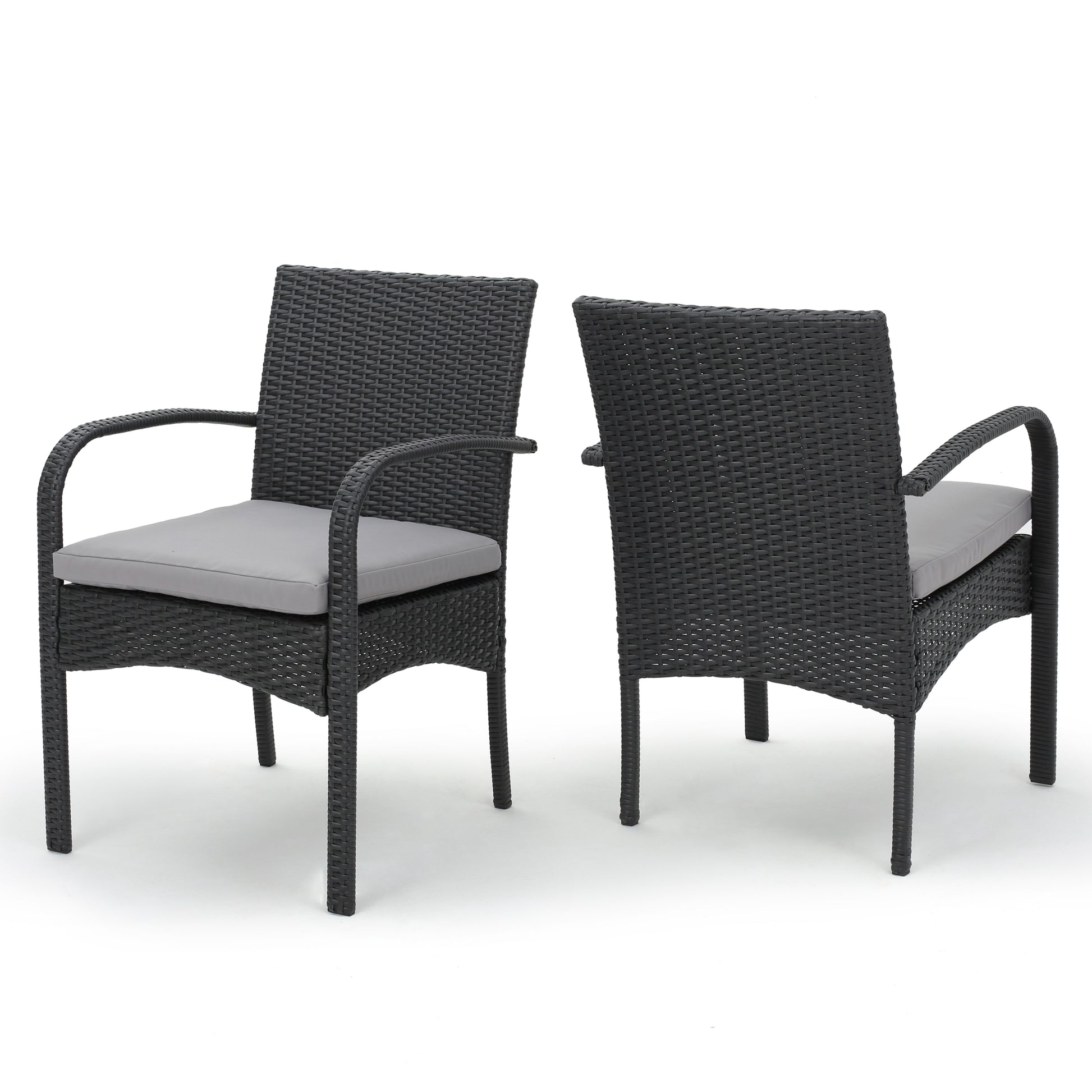 Two dark gray wicker patio chairs with light gray seat cushions ideal for outdoor dining