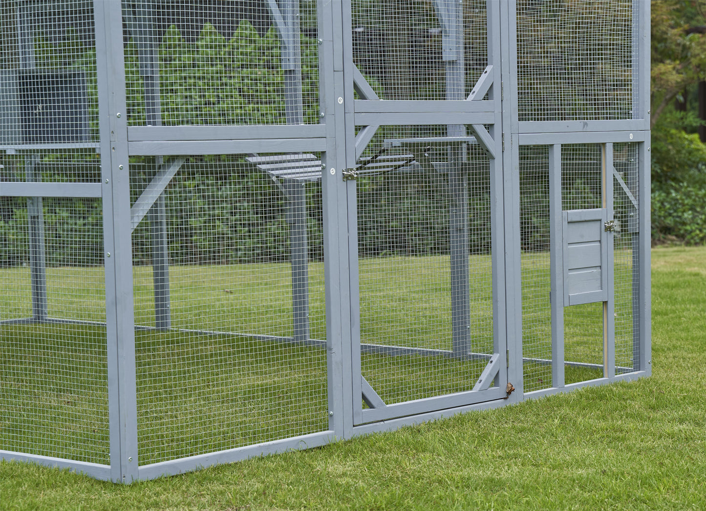 Gray wooden outdoor chicken coop with wire mesh spacious design