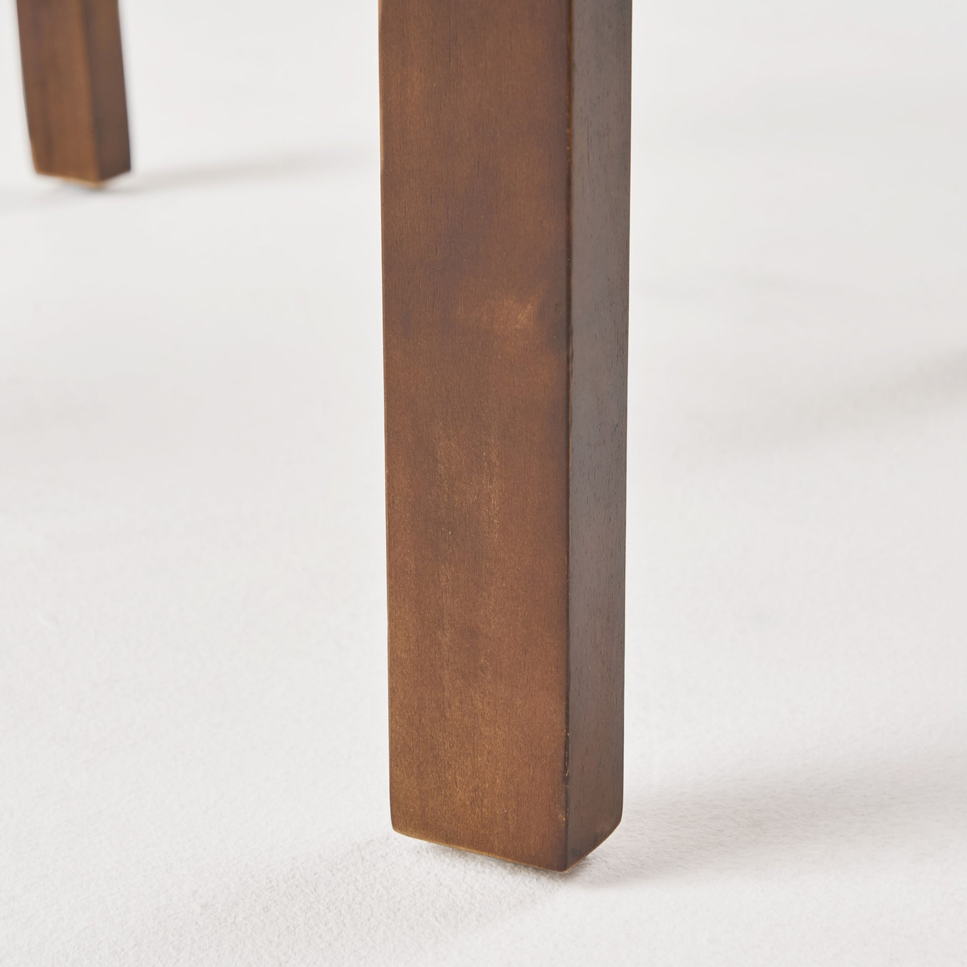 Solid wood furniture leg with rich walnut stain featuring clean straight lines