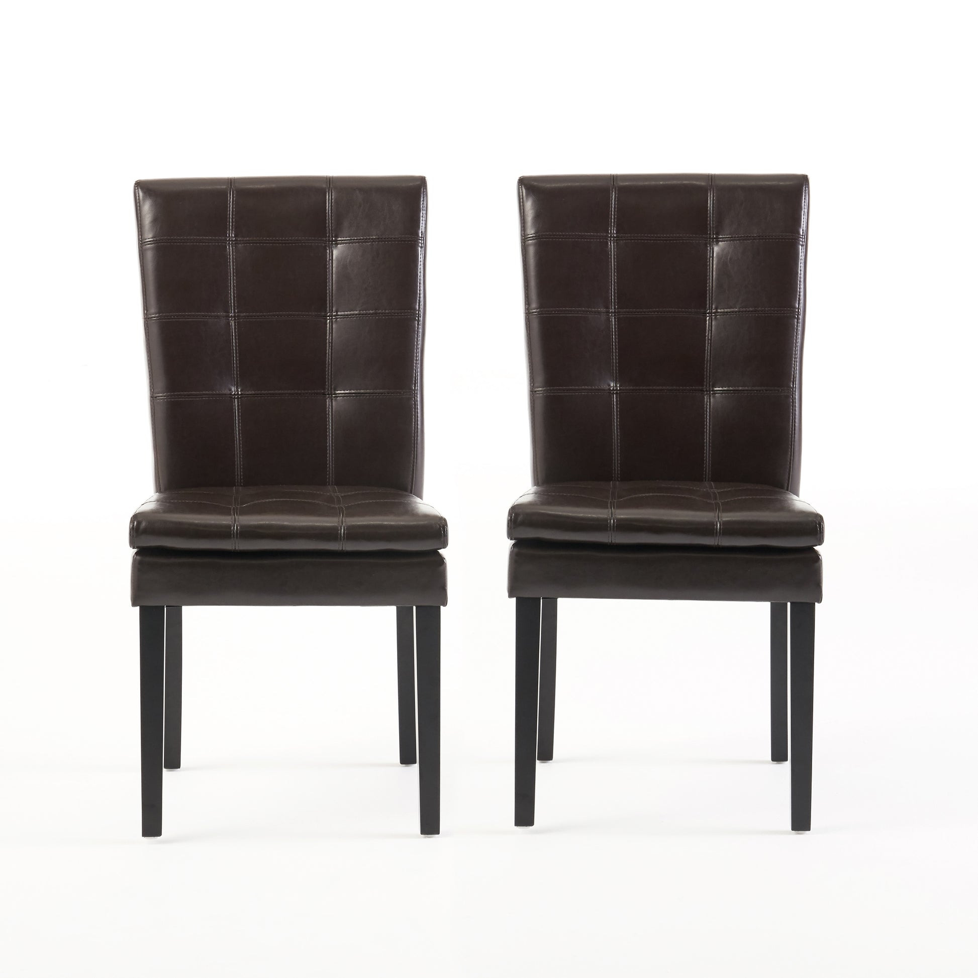 Two dark brown faux leather dining chairs with tufted backs and black metal legs