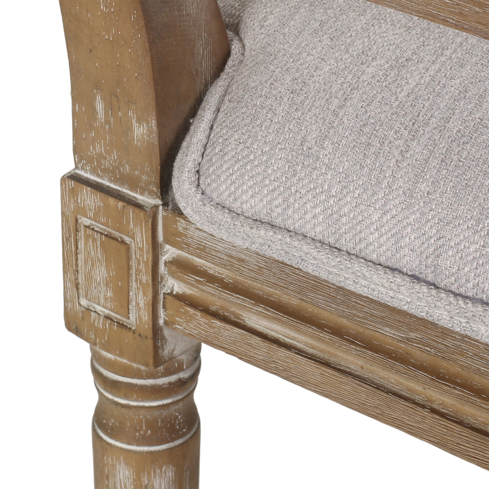 Rustic distressed wood armchair leg with upholstered grey fabric cushion