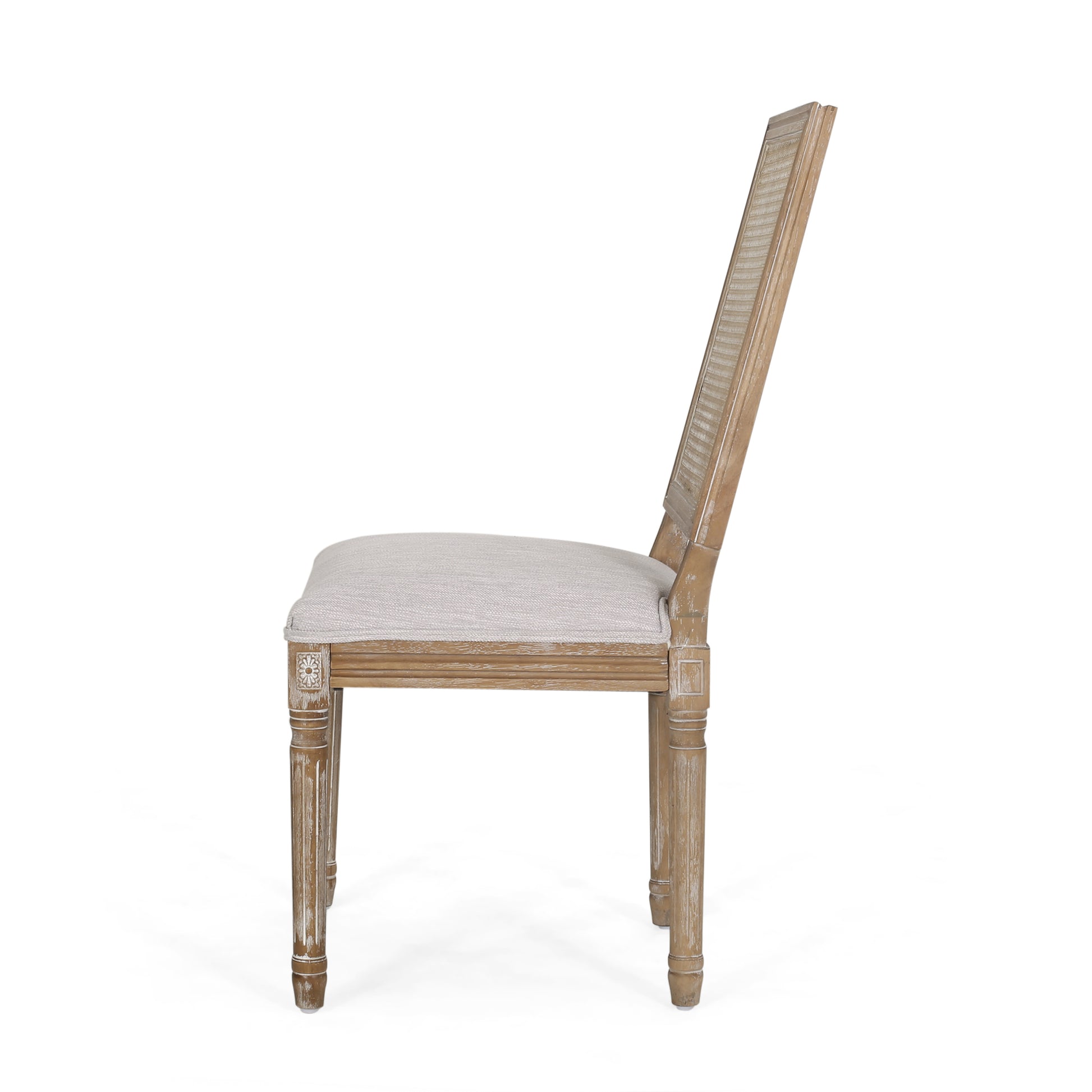 Distressed wood dining chair with light linen upholstered seat and cane back
