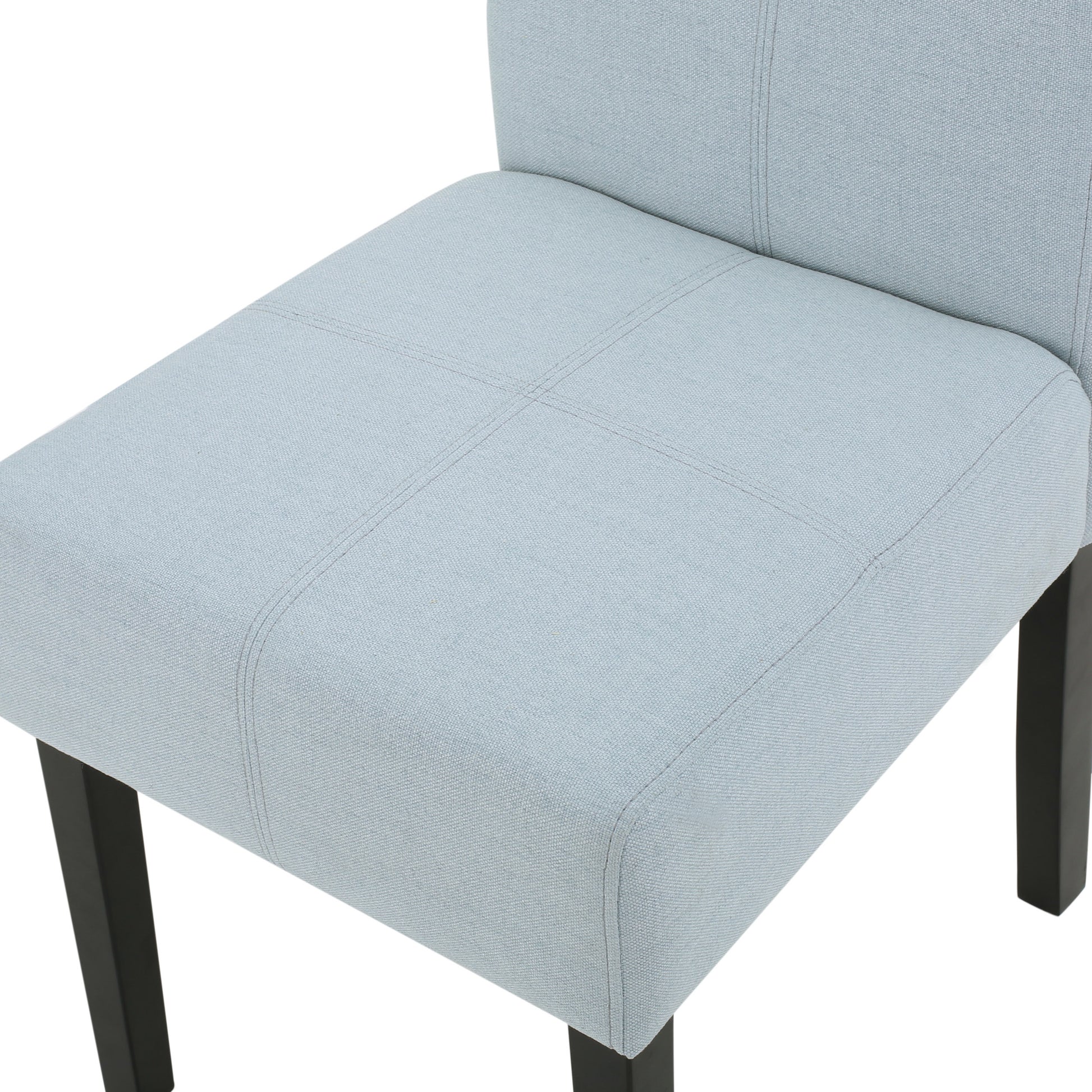 Light blue fabric dining chair with stitched seat detail and dark wood legs